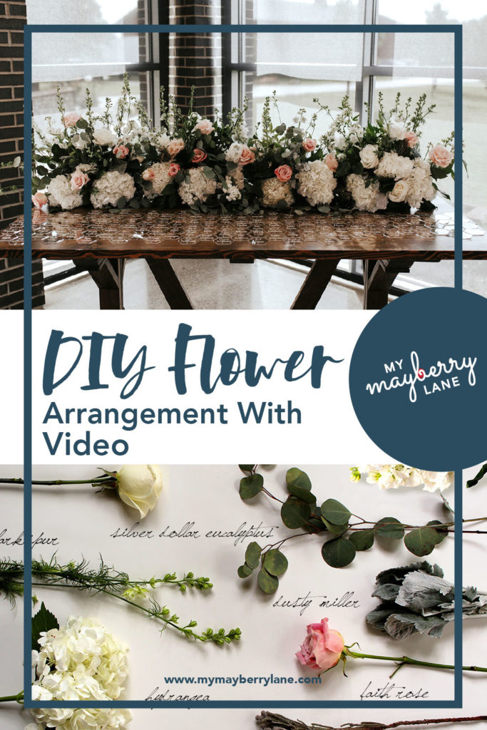Long flower arrangement on farm table with title DIY Flower Arrangement